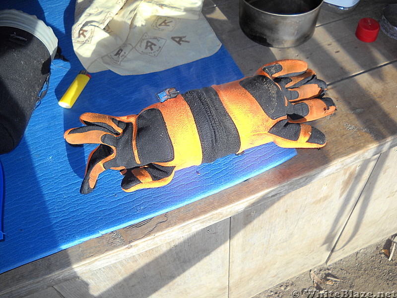 Drying gloves over stainless hot water bottle